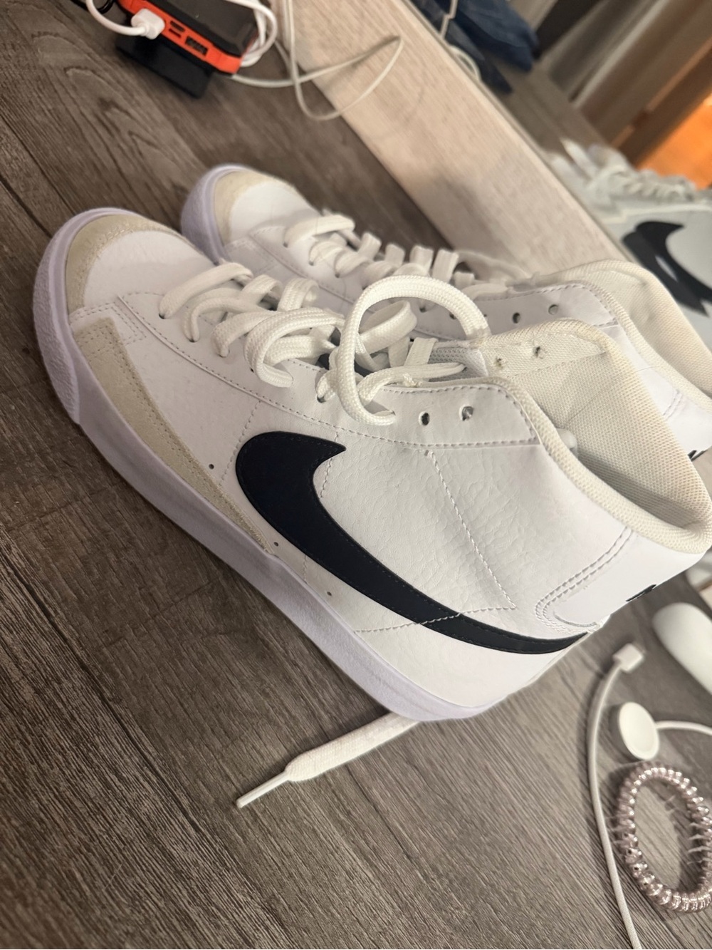 Nike womens White High-Top Sneakers with Black Swoosh